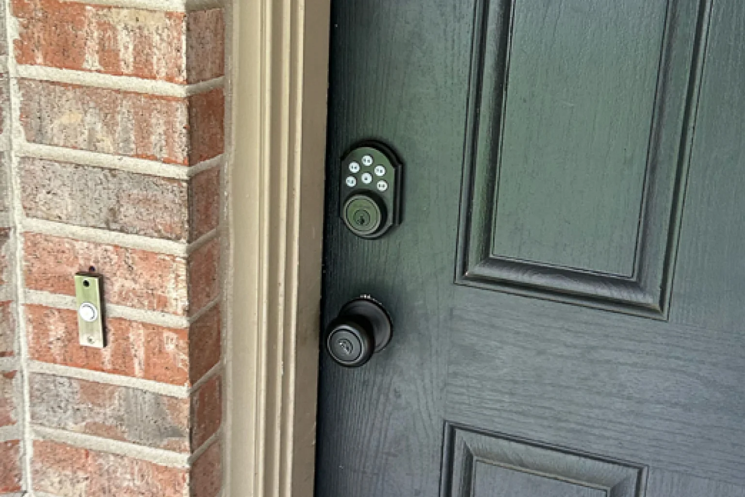 Digital keypad deadbolt installation on gray door