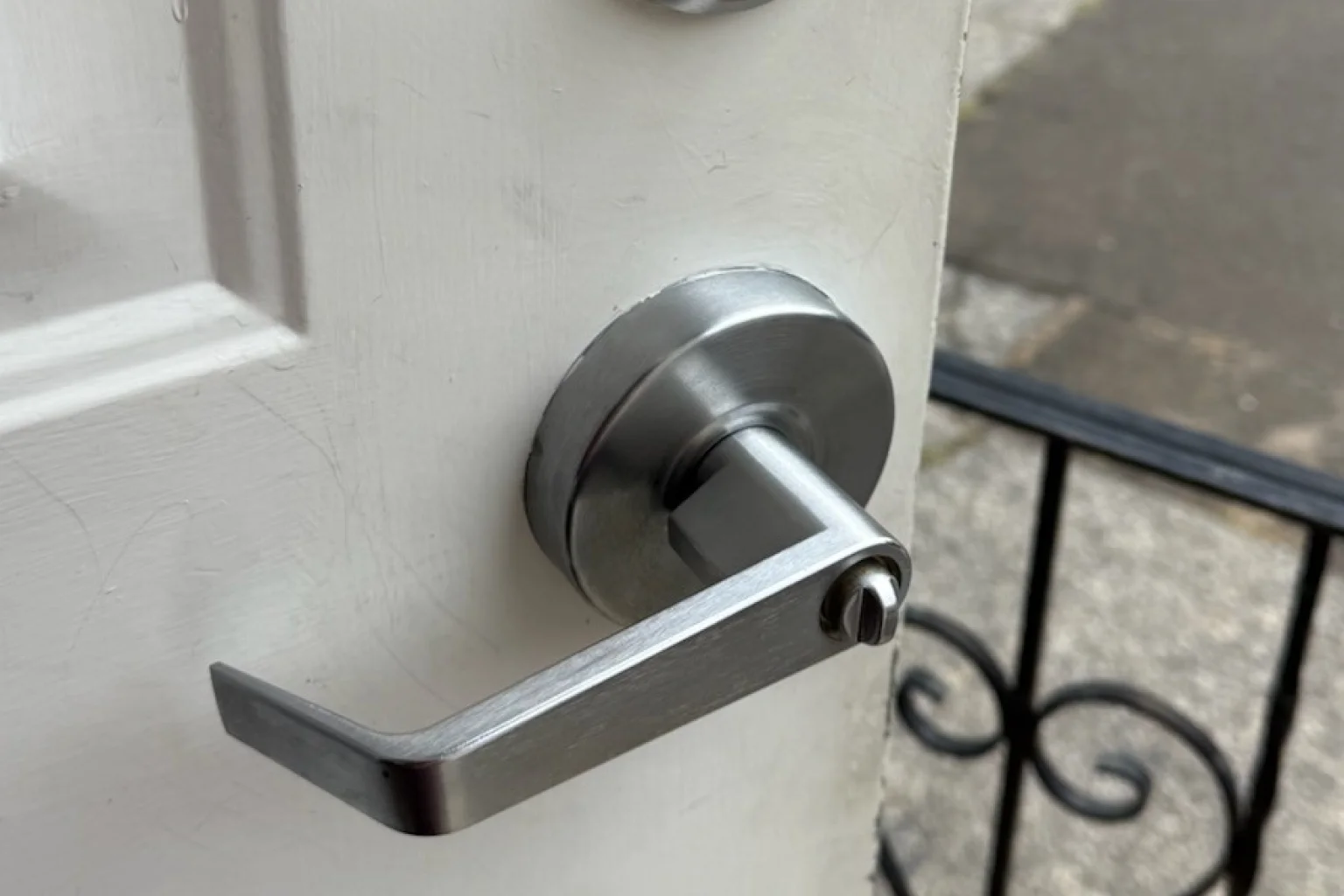 Modern stainless steel lever handle installation