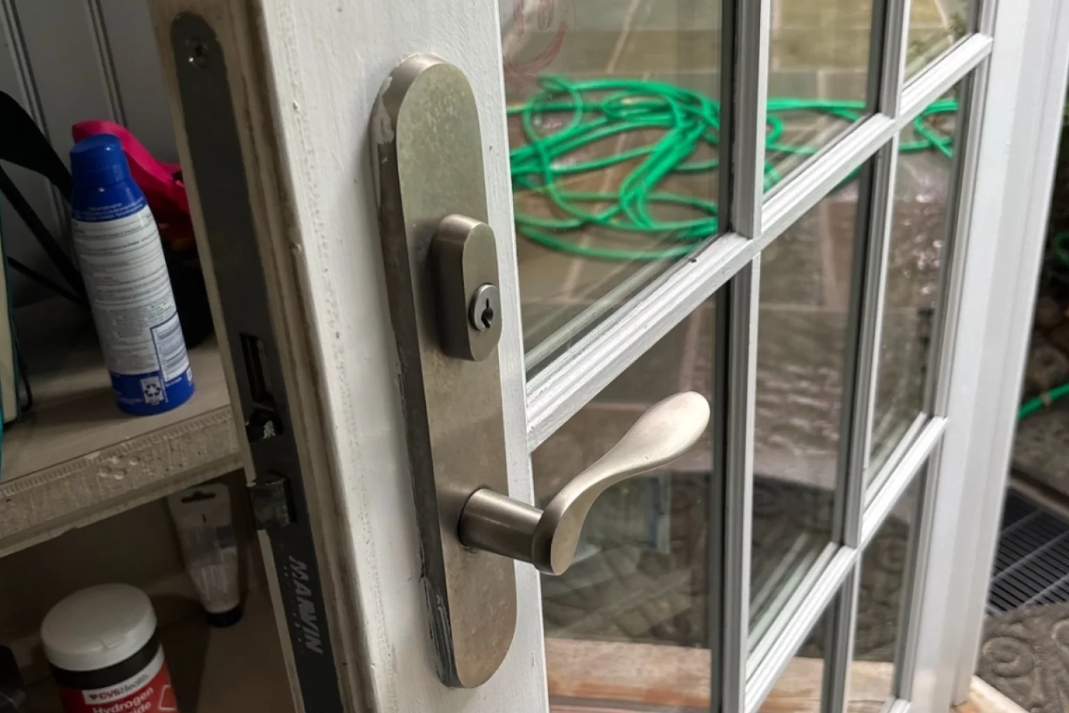 Storm door lock installation with lever handle
